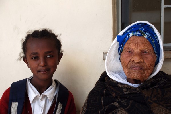 Turnesh stands with her young granddaughter in Ehtiopia