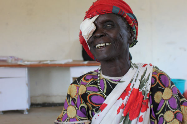 60-year-old grandmother Nyabel smiles after her cataract operation (copyright: Erna Mentesnot Hintz/ HelpAge International)