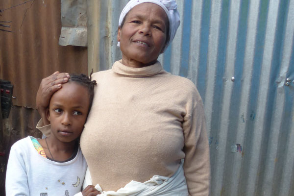 Aselefech and her granddaughter Mekedos, who is one of the people she cares for.  