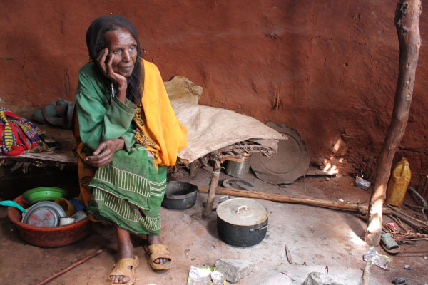 Older woman in Ethiopia with head in hand